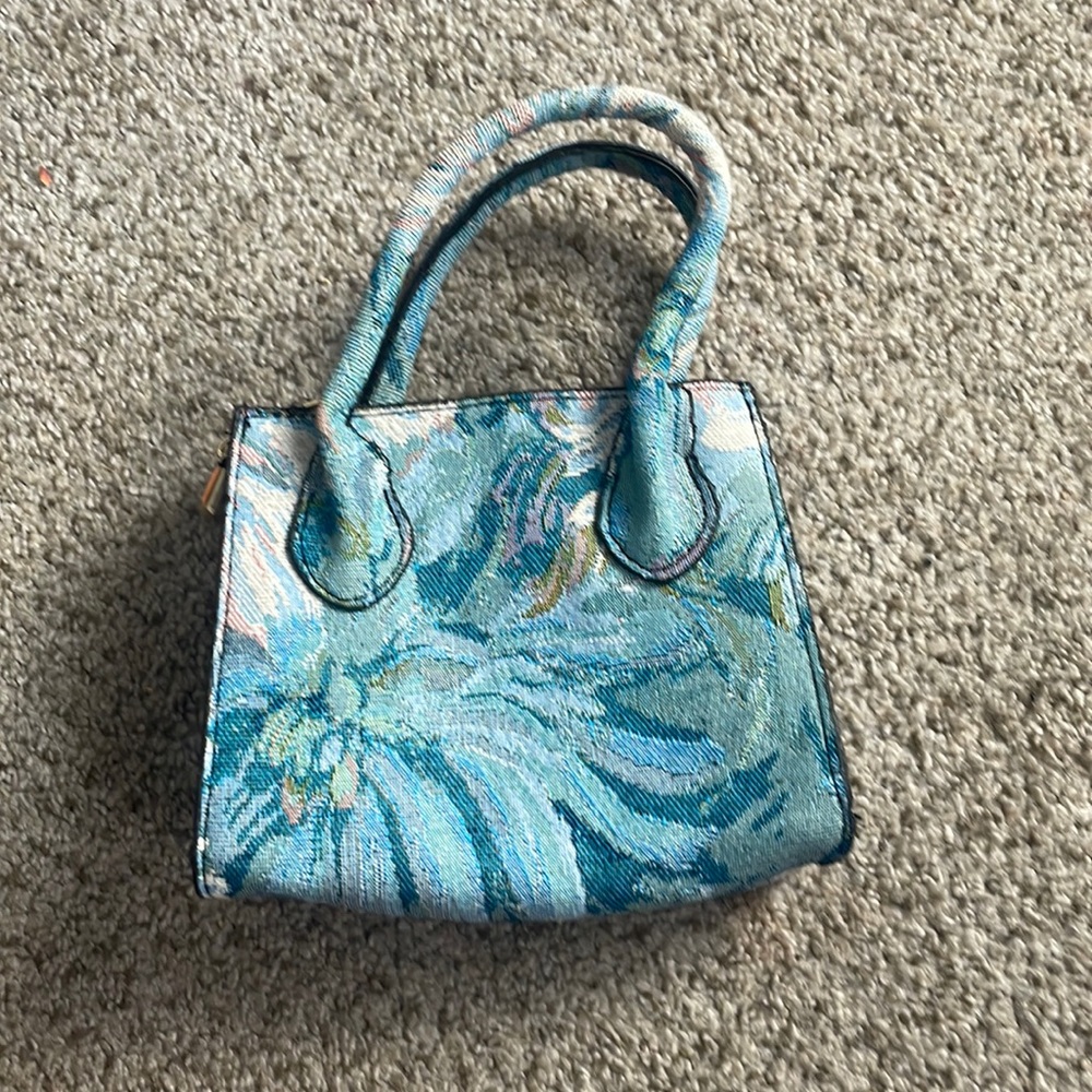 Mini satchel with denim inspired floral design